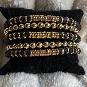 Set of 5 Black Clay and Gold Beaded Bracelet Set. Stretchy bands.